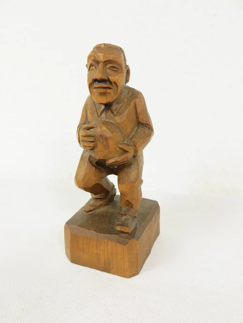 Old wooden figure of little old man