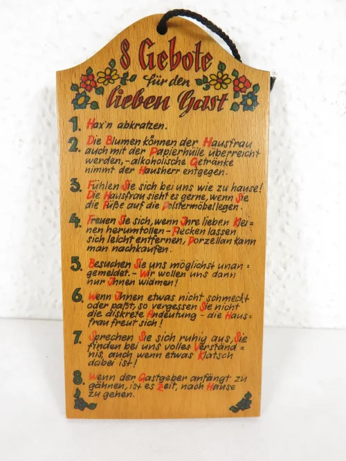 70s wooden sign with saying: 8 commandments to the dear guest